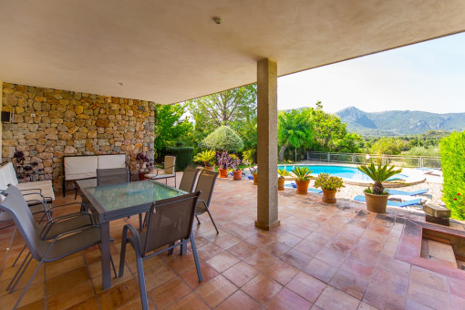 Views from the covered terrace to the pool area