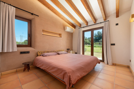 Master bedroom with direct garden access.