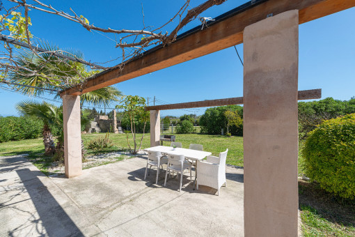 Outdoor Dining with Pergola and Nature Views